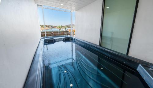 an indoor swimming pool with water in a building at Opus11 Poolvilla in Gyeongju