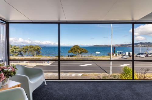 an office with a view of the ocean from a large window at Ika Nui Taupo in Taupo