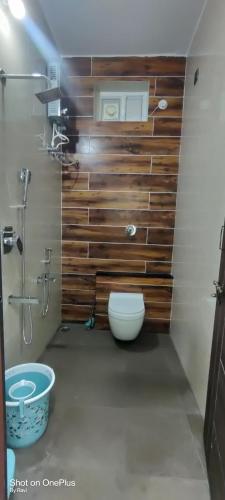 a bathroom with a toilet and a sink at Archana palace hampi in Hampi