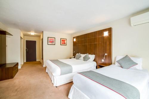 a hotel room with two beds at The Bridge House Hotel in Reigate