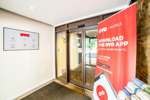 an entrance to a gymnasium with a door to the gymlordspool lab at The Bridge House Hotel in Reigate