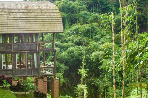 a tree house in the middle of a forest at Bagus Jati Health & Wellbeing Retreat in Tegalalang