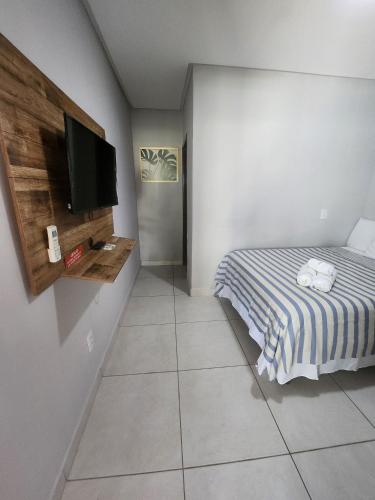 Cama o camas de una habitación en Casa encantadora com Piscina,Prainha e SPA