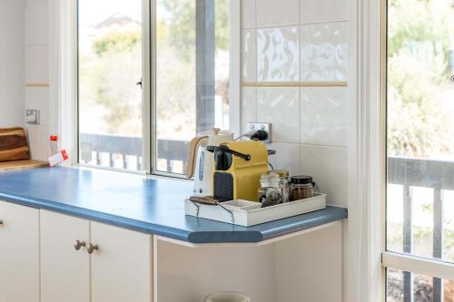 a kitchen counter with a yellow appliance on it at 24 Laurie Ave Encounter Bay - Linen Included in Encounter Bay