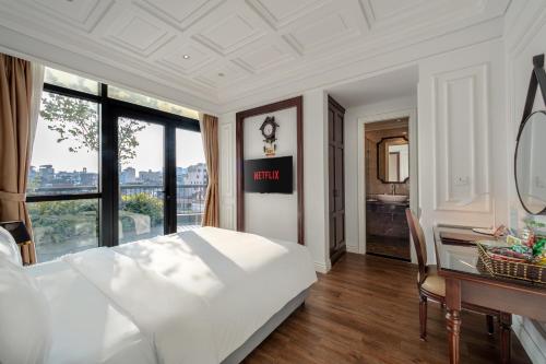 Postel nebo postele na pokoji v ubytování A25 Hotel - 18 Nguyễn Hy Quang