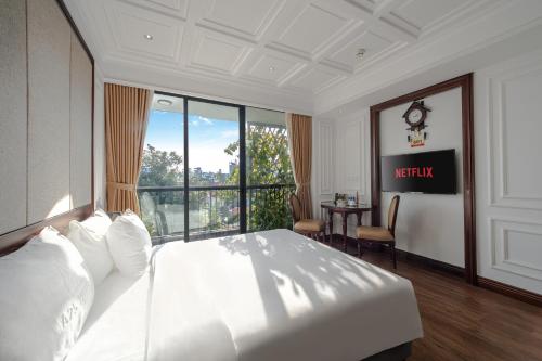 Postel nebo postele na pokoji v ubytování A25 Hotel - 18 Nguyễn Hy Quang