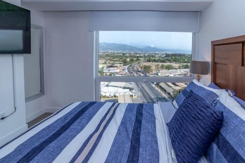 Letto o letti in una camera di Departamento 1102 - Edificio Entorno