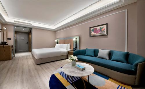 Ένα ή περισσότερα κρεβάτια σε δωμάτιο στο Mercure Chengdu Shuangliu