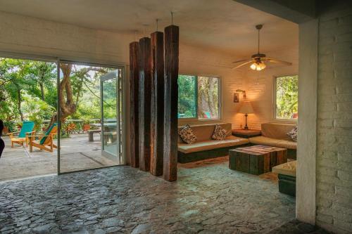 a living room with a couch and a table at Casa Soñada a la Orilla del Rio in Conca