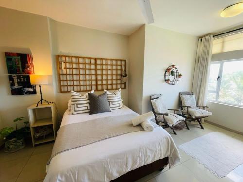 Ένα ή περισσότερα κρεβάτια σε δωμάτιο στο Beach Home Away From Home