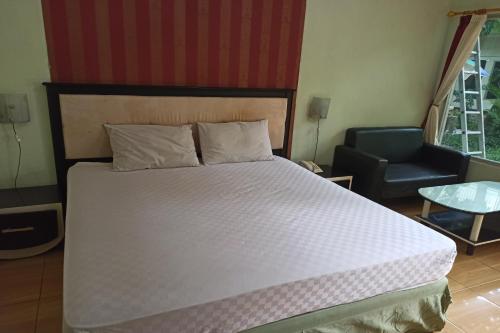 Cama o camas de una habitación en Hotel O Wisma Flamboyan NearTaman Makam Pahlawan