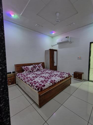a bedroom with a bed in a room at Prem NATH Homestay in Garudeshwar