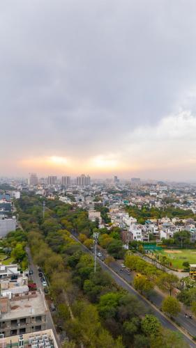 an overhead view of a city with a road at Eternal Oasis by Alaya Stays, Golf Course Road in Gurgaon