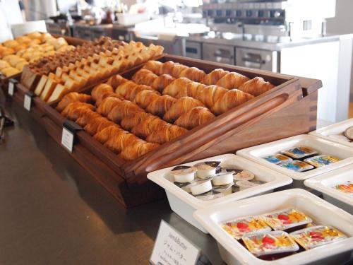 a display of breads and pastries in a bakery at Hotel Vison in Taki