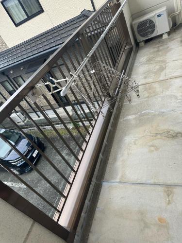 an overhead view of a metal structure on a stairway at A203 KASUMI-an 絢 in Kumamoto
