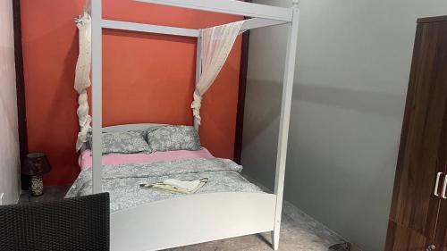 a bunk bed with a white bunk bed frame at Cabilao Sunset Dive & Beach Resort in Loon