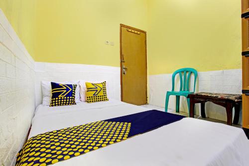 Una cama o camas en una habitación de Hotel O Juan Kostel