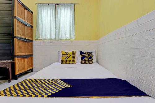 Una cama o camas en una habitación de Hotel O Juan Kostel
