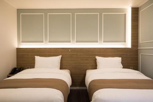 Ένα ή περισσότερα κρεβάτια σε δωμάτιο στο Casaloma Hotel