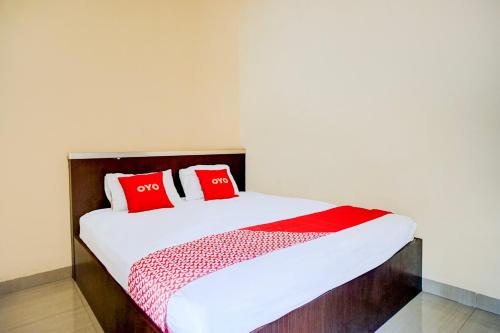 Ένα ή περισσότερα κρεβάτια σε δωμάτιο στο Hotel O Syukur 07 Syariah