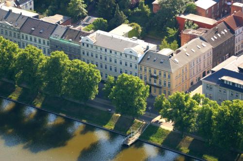 an aerial view of a building next to a river at Hotel Niederländischer Hof in Schwerin