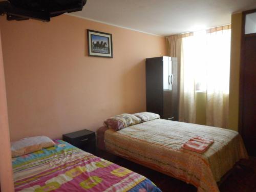 Katil atau katil-katil dalam bilik di Hostal Geminis