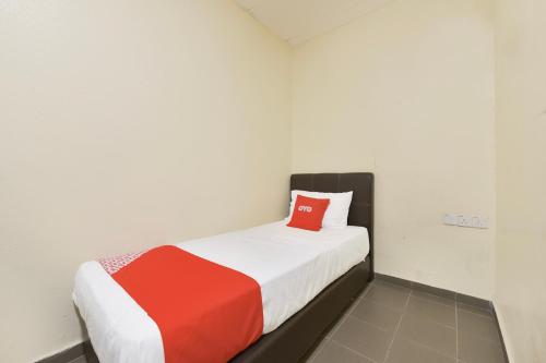 Ένα ή περισσότερα κρεβάτια σε δωμάτιο στο Hotel O Gest Inn