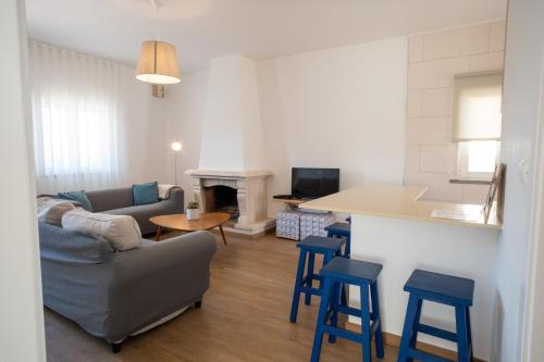a living room with a couch and a table at SEAING HOUSE in Falca
