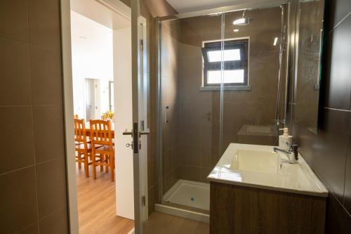 a bathroom with a sink and a shower at Seaing House II in Falca