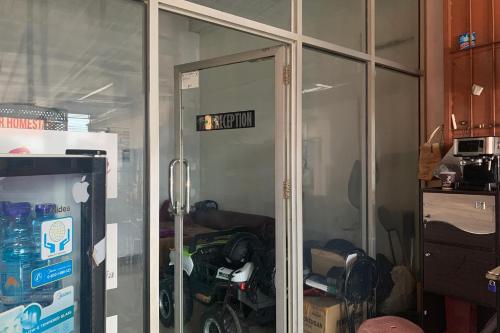a glass door in a kitchen with a room at Hotel O Atifah Homes in Sungguminasa