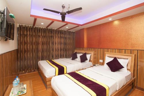 OYO 814 Machhapuchhre Hotelにあるベッド