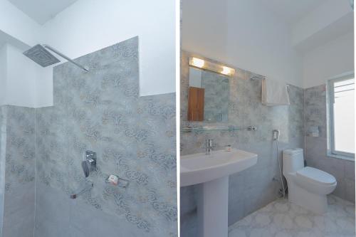 a bathroom with a sink and a toilet and a shower at OYO 799 Hotel Tik Tok Pvt Ltd. in Kathmandu