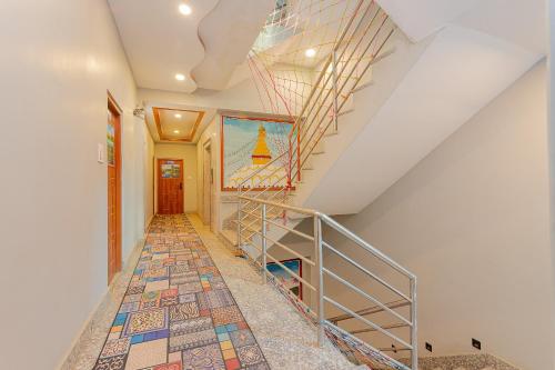 a staircase with a mosaic floor in a house at OYO 799 Hotel Tik Tok Pvt Ltd. in Kathmandu