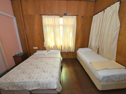 Hotel O Teratak Samuderakita, Chalet & Guesthouseにあるベッド