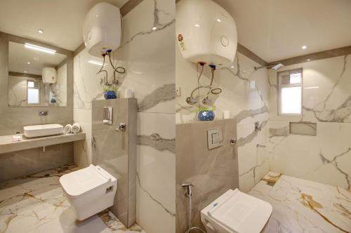 a bathroom with a toilet and a shower and a sink at Hotel International Inn - Near Delhi Airport in New Delhi