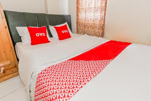 En eller flere senge i et værelse på Hotel O Dms Property