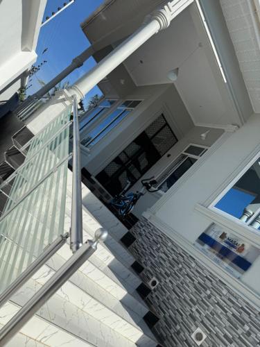 a view of a glass railing on a house at MASAI Apartment Goba in Dar es Salaam