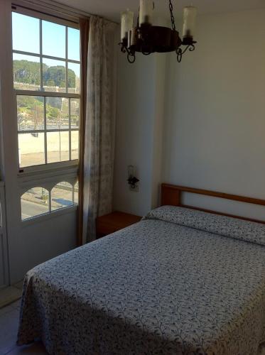 Ένα ή περισσότερα κρεβάτια σε δωμάτιο στο Hotel Pinzon
