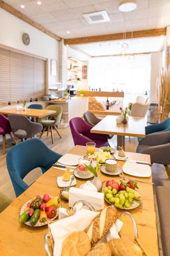 a table with food on it in a cafeteria at Winzerhof Lentsch in Jois
