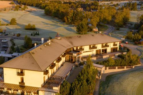 an aerial view of a building with a roof at Hotel International in Tatranská Lomnica