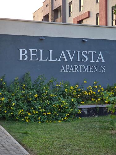 a sign for a bellevania apartment building at Lakeview Condo at Pearl marina Garuga in Kagolomolo