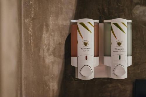 a group of three wii remotes hanging on a wall at Bocobay LUX Villas Bubali in Palm-Eagle Beach