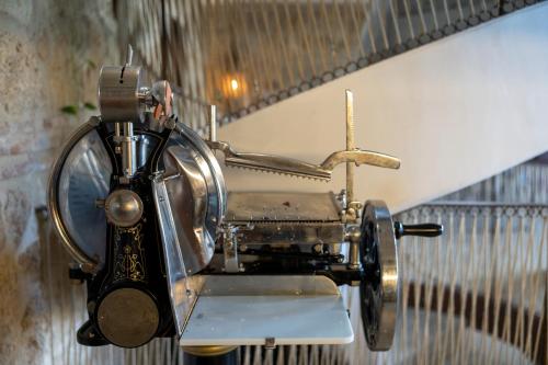 an old fashioned airplane hanging on a wall at Hotel Boutique Patio del Posadero in Córdoba