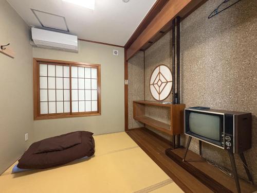 TV a/nebo společenská místnost v ubytování Arcade Resort Okinawa