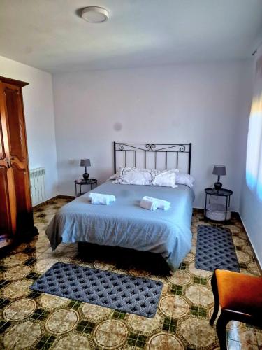 a bedroom with a bed with two pillows on it at VV Casa Leonor in Asiego