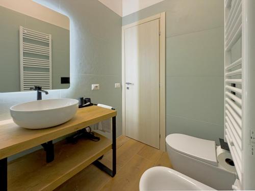 a bathroom with a sink and a toilet at Vatican Dolce Remy Guest House - Metro Cipro in Rome