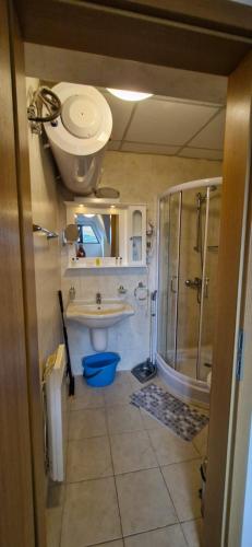 a bathroom with a shower and a toilet and a sink at Aspen golf studio B402 in Razlog