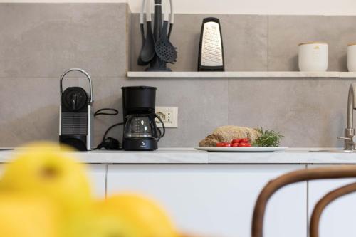 a kitchen counter with a plate of food on it at 900 - Guest House in Livorno