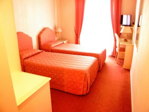 Postel nebo postele na pokoji v ubytování Albergo Ristorante Bigiù