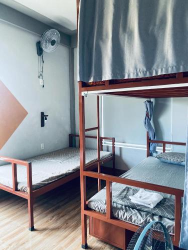 Кровать или кровати в номере Cối Xay Gió Homestay Quảng Bình